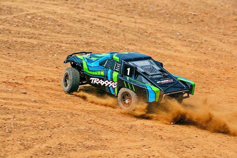 68077-468077-4-slash-4x4-ultimate-green-action-3qtr-rear-left-dirt-dx1i0856
